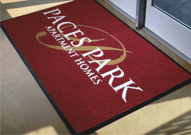 Waterhog Inlay custom floor mat with logo used inside an apartment building as an indoor logo mat