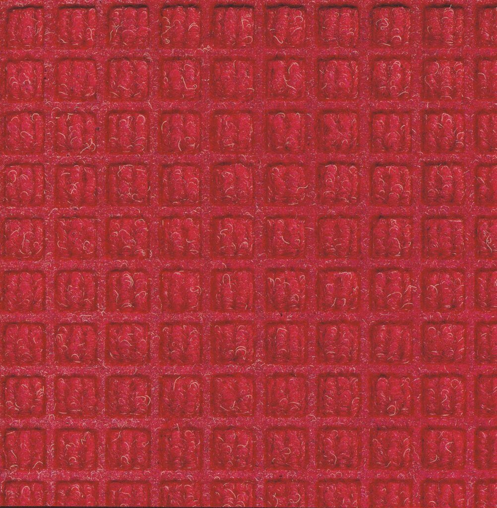 Close up view of Solid Red Waterhog Classic entrance mat showing waffle surface pattern of the door mat