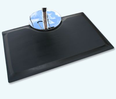 Multi Flex Salon Mat with cut out with stylist chair sitting on top of the smooth black floor mat surface